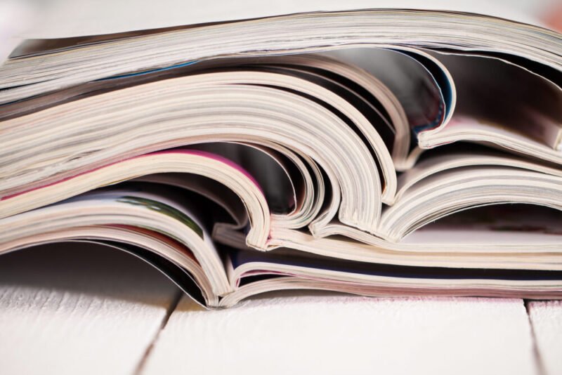 Pile of colorful magazines on a table